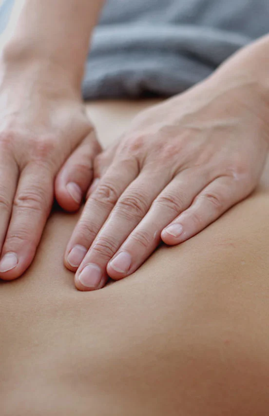 massage therapist giving massage therapy to a client